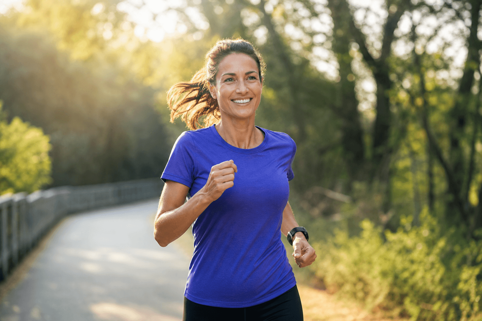 Woman in her 40s running on an outdoor trail