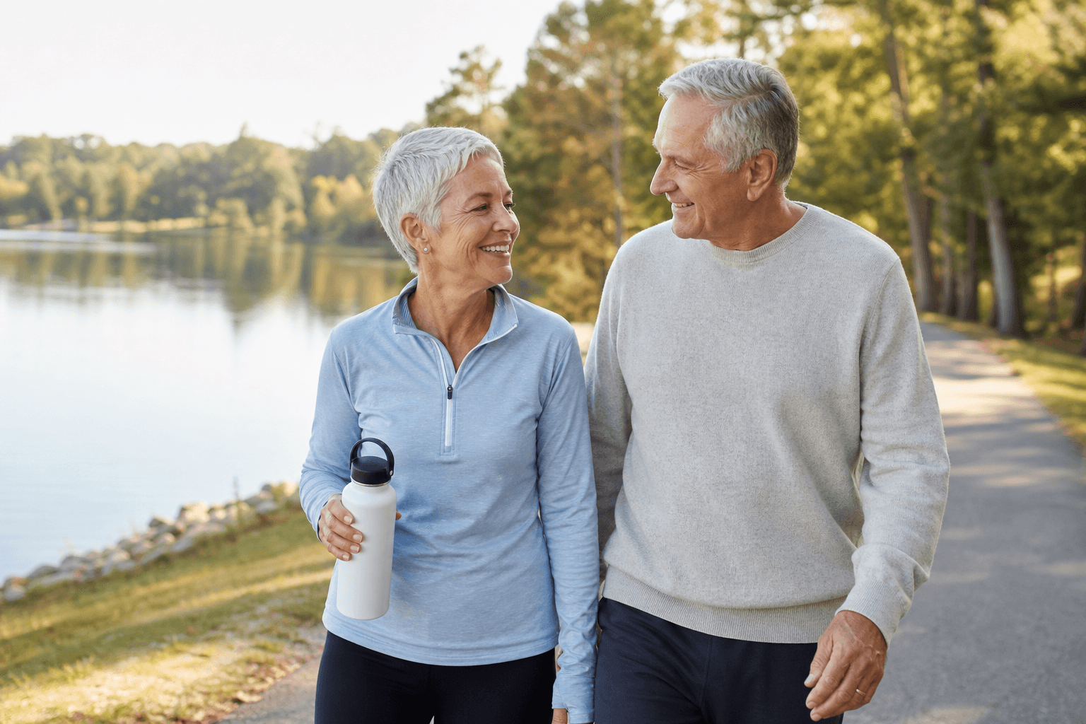 Active couple walking outdoors after knee replacement recovery